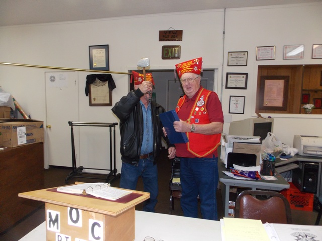 Seam Squirrel Ed Rose about to “bop” installing officer - All Star PGC Dennis Marsh - at conclusion of his installation.